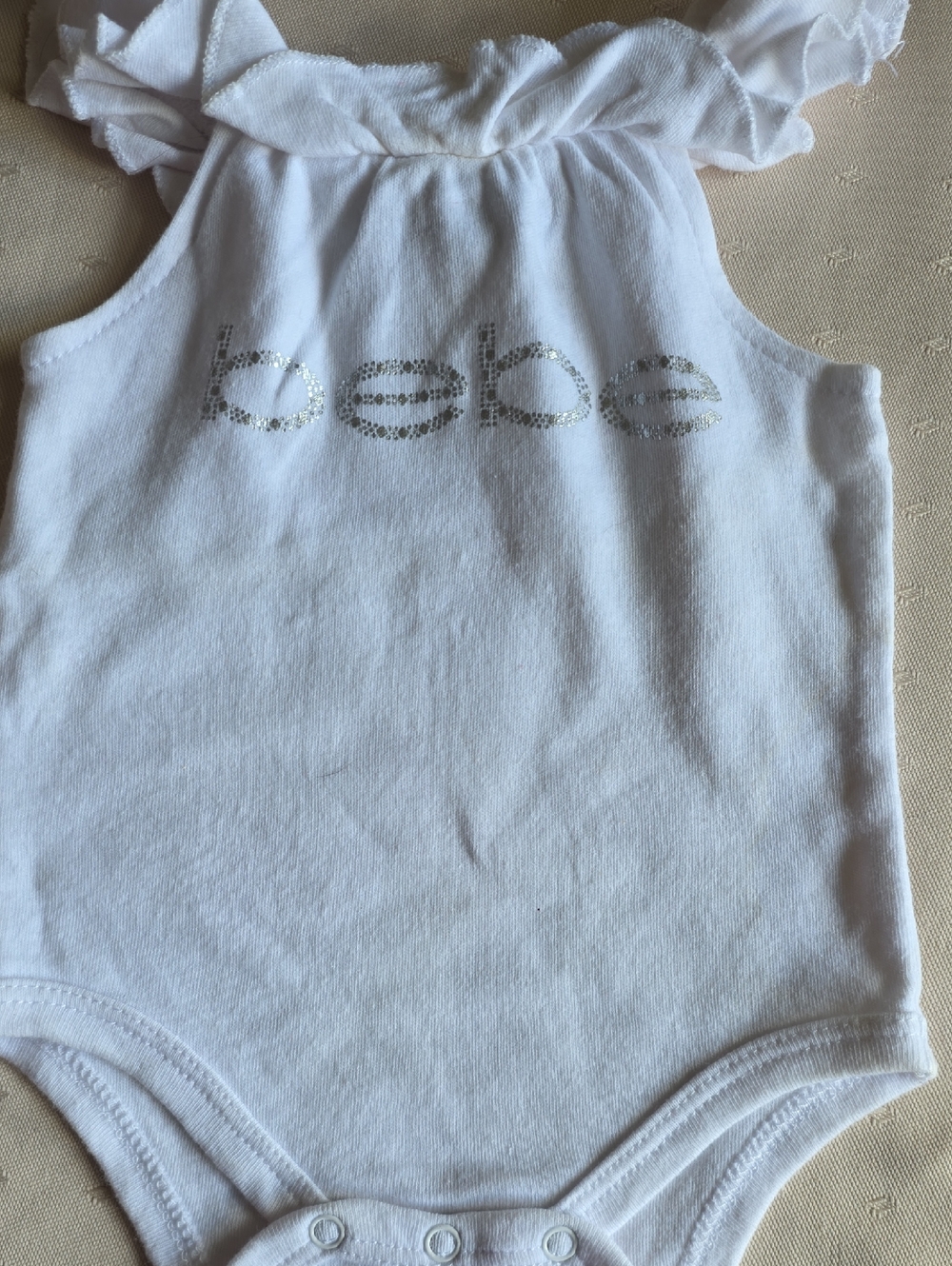 bebe White Baby One-Piece with Silver Logo